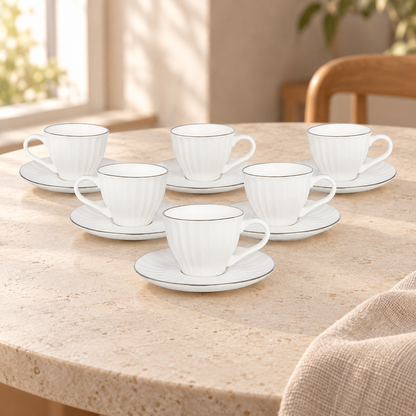 Acar SET810BE Charisma white cups with silver-tone rims — AI-assisted cafe table scene