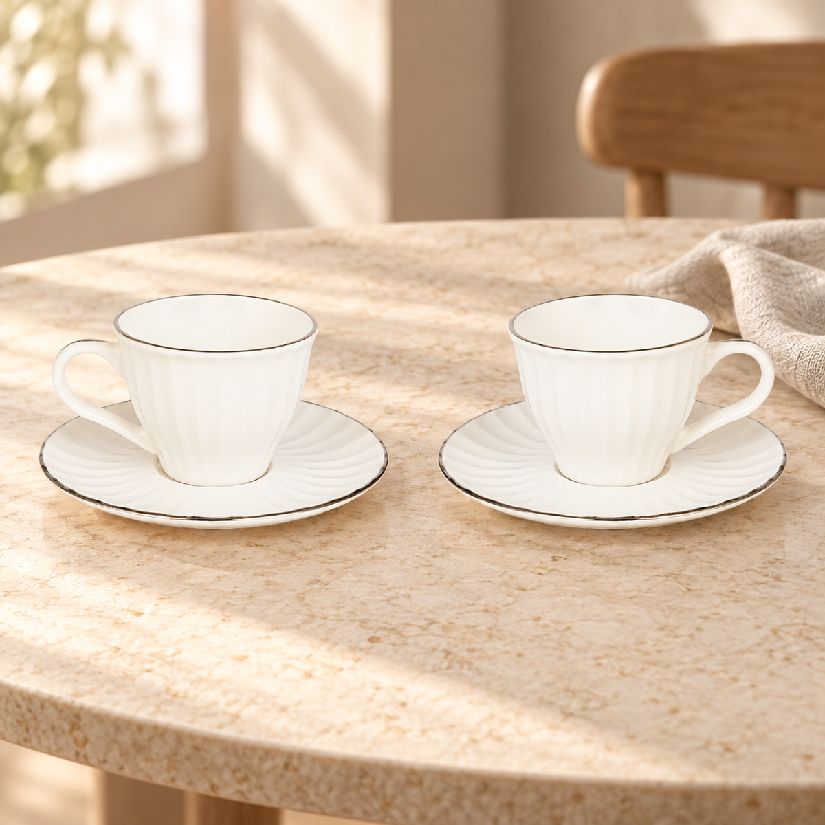 Acar SET820BE Charisma two-cup set with silver-tone rims — AI-assisted cafe table scene